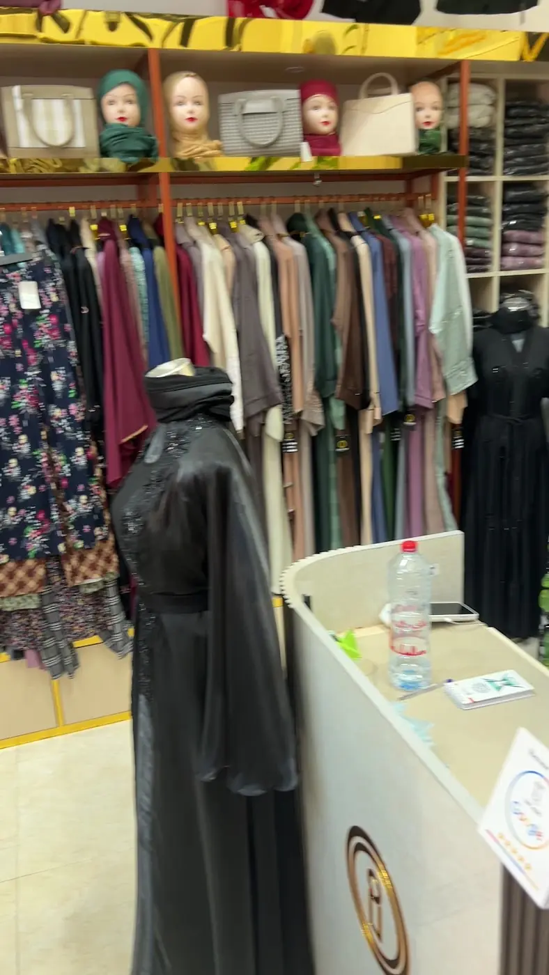 Inside the Inayah boutique: racks of abayas, shaylas and bags