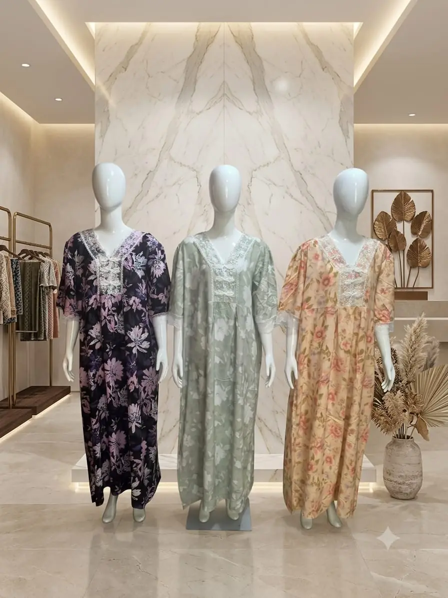 Three embroidered kaftans displayed at Inayah