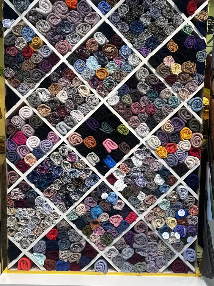 Wall of shaylas in many colours at Inayah